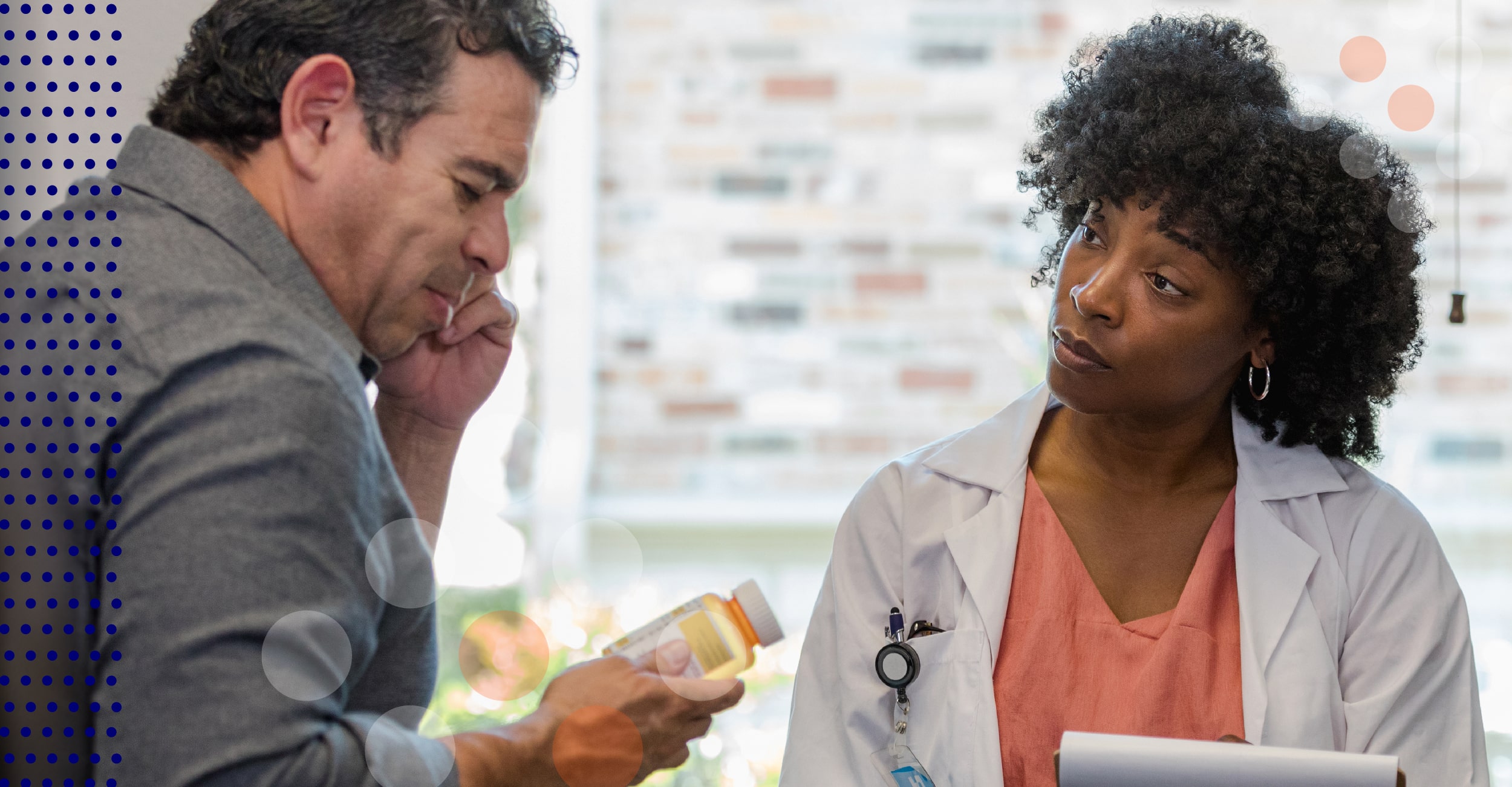 Patient speaks to a doctor in a doctor's office.